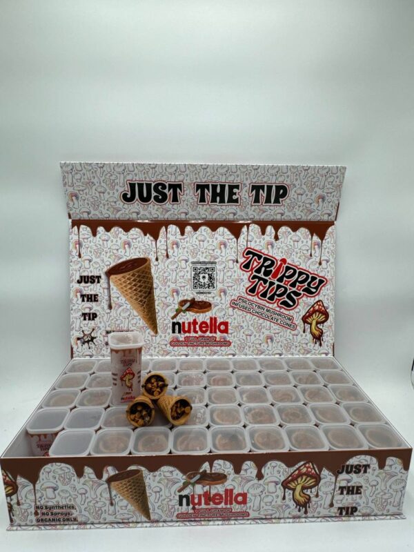 A sleek, stylish box labeled Trippy Tips Nutella Golden Cone Master Box,' featuring pre-rolled cones filled with a blend of Golden Teacher mushrooms and Nutella. The cones and packaging emphasize the convenience, quality, and delicious flavor of this psychedelic product